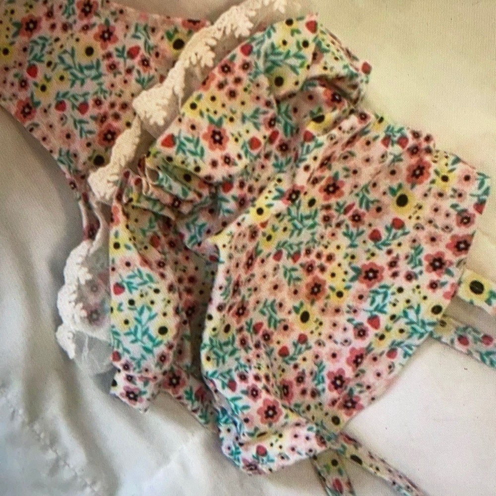 Features vibrant colors ruffle one piece